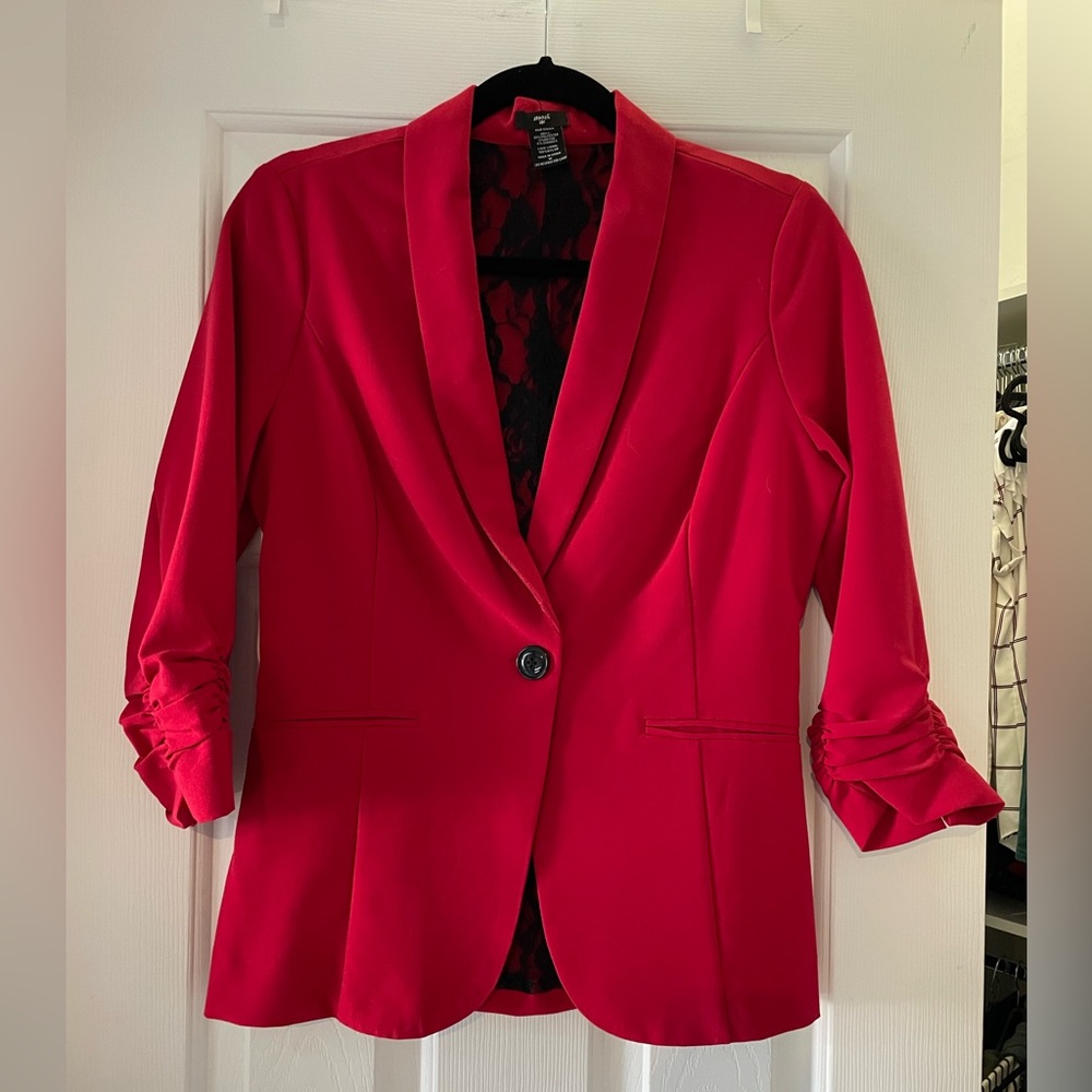 Women’s medium red blazer w/one button and faux pockets.
